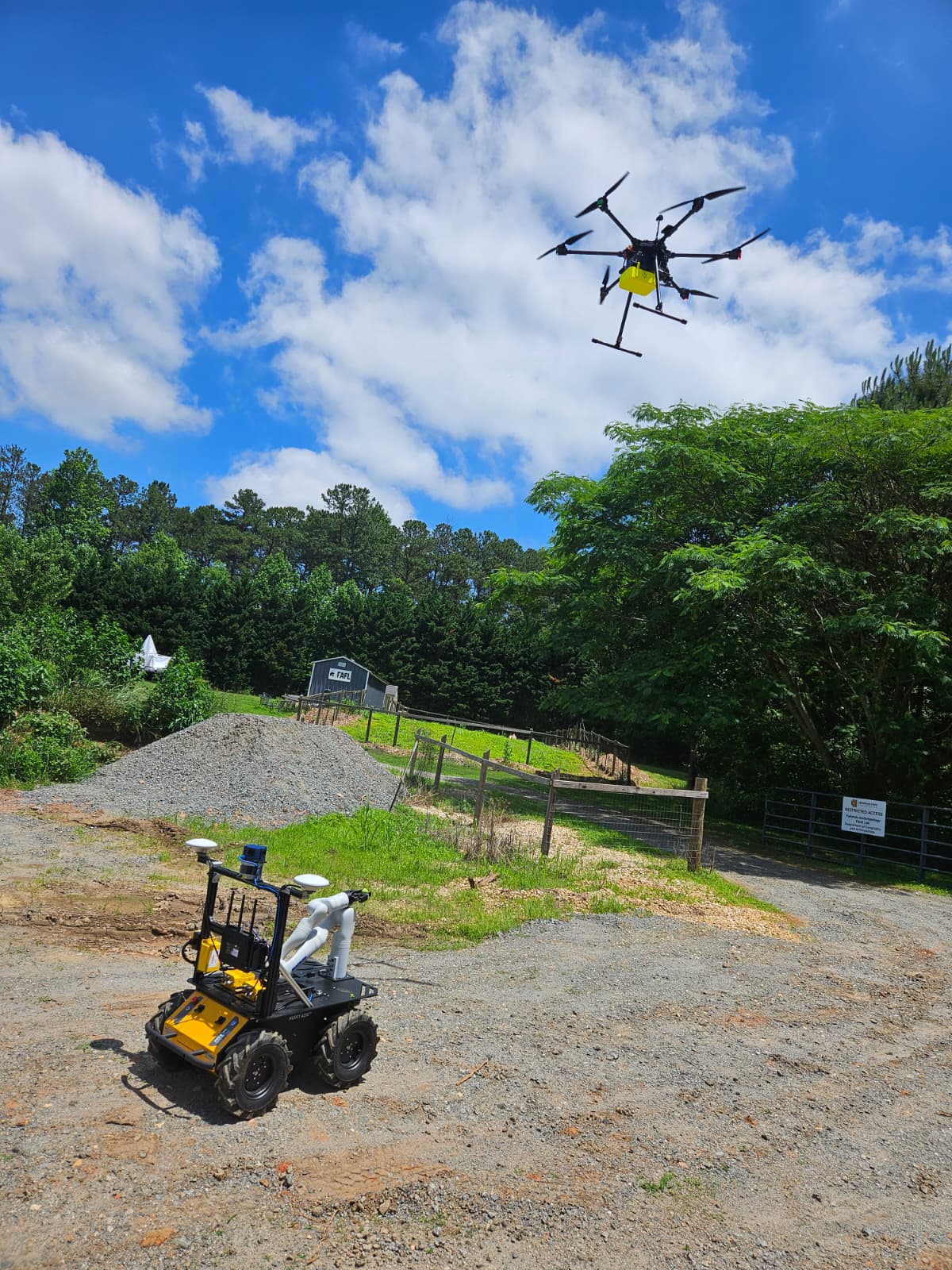 A drone and ground robot operating together on the PLOT field site